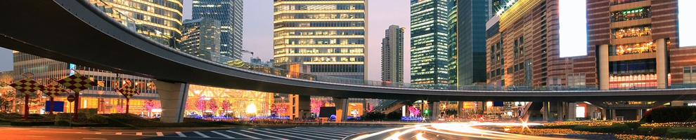City skyline with an elevated highway at dusk
